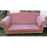 A contemporary, but traditional style, two seat camel back sofa with rolled arms, repeating