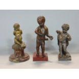 A collection of three various cast metal studies of cherubs/children, the largest 17 cm high (3)