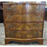 A reproduction Georgian style walnut veneered four drawer chest with serpentine front and shaped