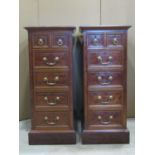 A pair of good quality mahogany and inlaid bedside/lamp chests, each fitted with four long and two