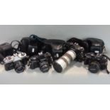 Box of manual SLR cameras to include a Fugica, Shinon, etc, all include lenses.