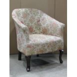 An Edwardian tub chair with floral patterned upholstery and cabriole forelegs together with one