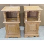 A matched pair of stripped pine bedside cupboards each enclosed by a fielded panelled door beneath