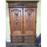 A substantial 19th century oak bookcase, the front elevation enclosed by a series of six short