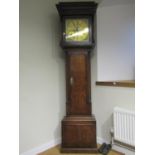 An early Georgian oak longcase clock, the full length door crossbanded in walnut with column