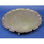 1960s Georgian style silver salver with pie crust rim, engraved inscriptions and four scrolled feet,