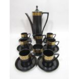 A Portmeirion coffee set by Susan Williams-Ellis, with gilt Greek key border decoration on a black