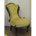 A mid Victorian period mahogany drawing room chair, the moulded framework with carved and pierced