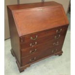 A 19th century mahogany bureau, the fall flap enclosing an interior of small drawers and pigeon