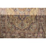 A large Belgian carpet in a Persian style with typical floral and repeating detail, 320 x 245cm