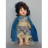 Vintage doll by Pedigree with closing eyes, floral dress, velvet cape and bonnet, height 35cm