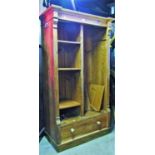 A 19th century stripped pine side cupboard with open segmented adjustable shelves (originally