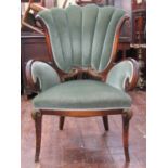 Flamboyant drawing room chair, the urn shaped back set between pronounced scrolled arms and raised