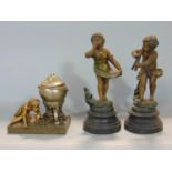 Good quality ormolu and spelter novelty ink well in the form of a boy lighting a fire under a