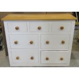 A contemporary oak and pine dresser with partially painted finish and fitted with an arrangement