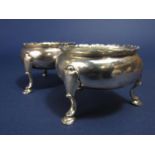 Pair of good quality early Georgian silver table salts of ovoid form, with acanthus cabriole hoof
