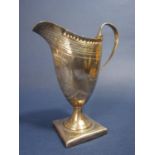 Georgian silver helmet shaped cream jug with engraved banded decoration and further floral sprays,