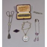 Collection of antique silver / white metal jewellery comprising an enamelled circular locket with