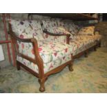 An Edwardian mahogany three piece suite comprising three seat sofa and a pair of matching