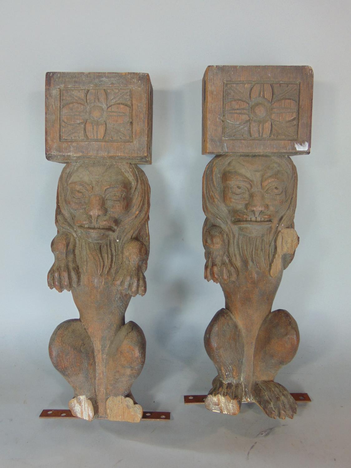A pair of 19th century carved oak rampant lions