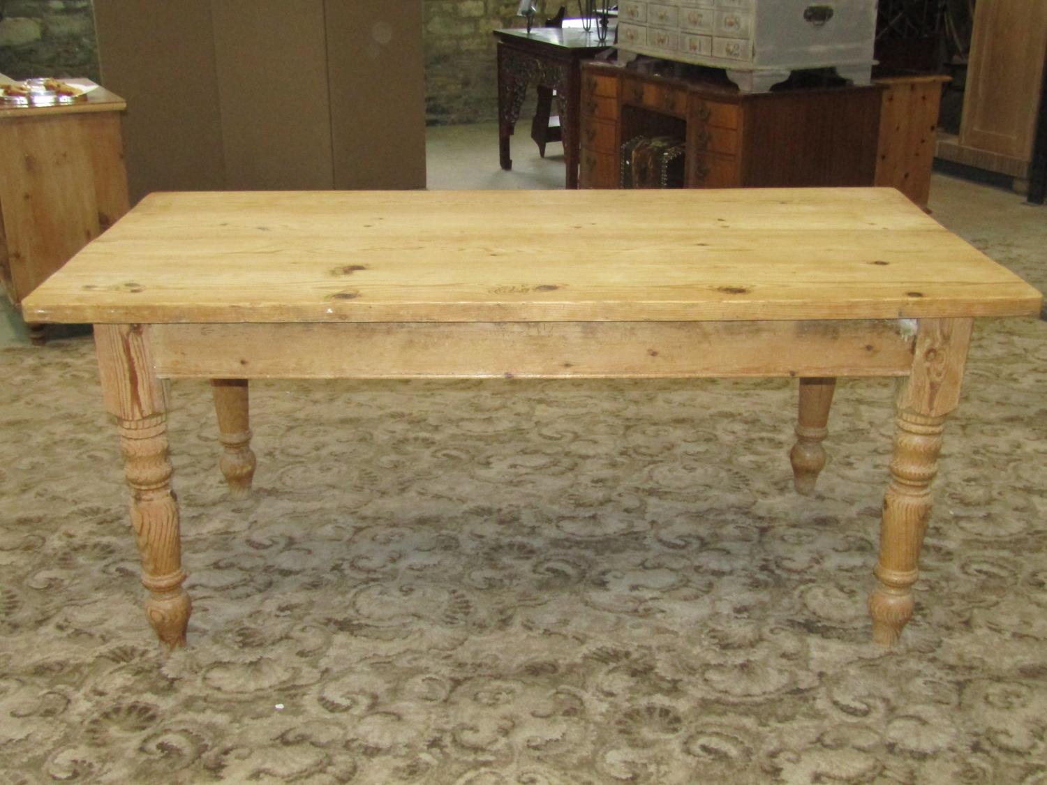 A reclaimed stripped pine farmhouse kitchen table of rectangular form raised on four ring turned and - Image 2 of 5