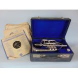 The Lark trumpet, silver plate with case, together with a quantity of 78rpm records, vinyl singles