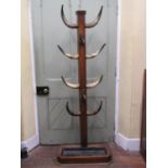 Victorian oak hat stand supporting ten polished cattle horns, the rectangular base with drip tray