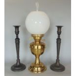 Brass duplex oil lamp with glass shade and flu, 54 cm high in total, together with a pair of iron