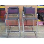A set of four chair back high stools, in the LOe Corbusier style with faux stitched leather strap