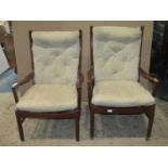 A pair of vintage mid-20th century Parker Knoll open armchairs, with moulded frames, sprung seats