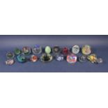 A collection of 17 paperweights to include novelty weights in the form of a tortoise, cat, birds,