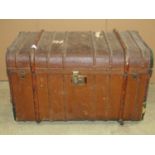 A vintage brown fibre and timber lathe bound trunk with domed lid and brass fittings, 896 cm long