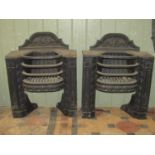 A pair of small 19th century cast iron bedroom grates, with bow fronted basket and raised foliate