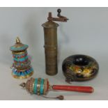 Two Buddhist prayer wheels with enamel and stone setting, a Turkish brass coffee grinder of