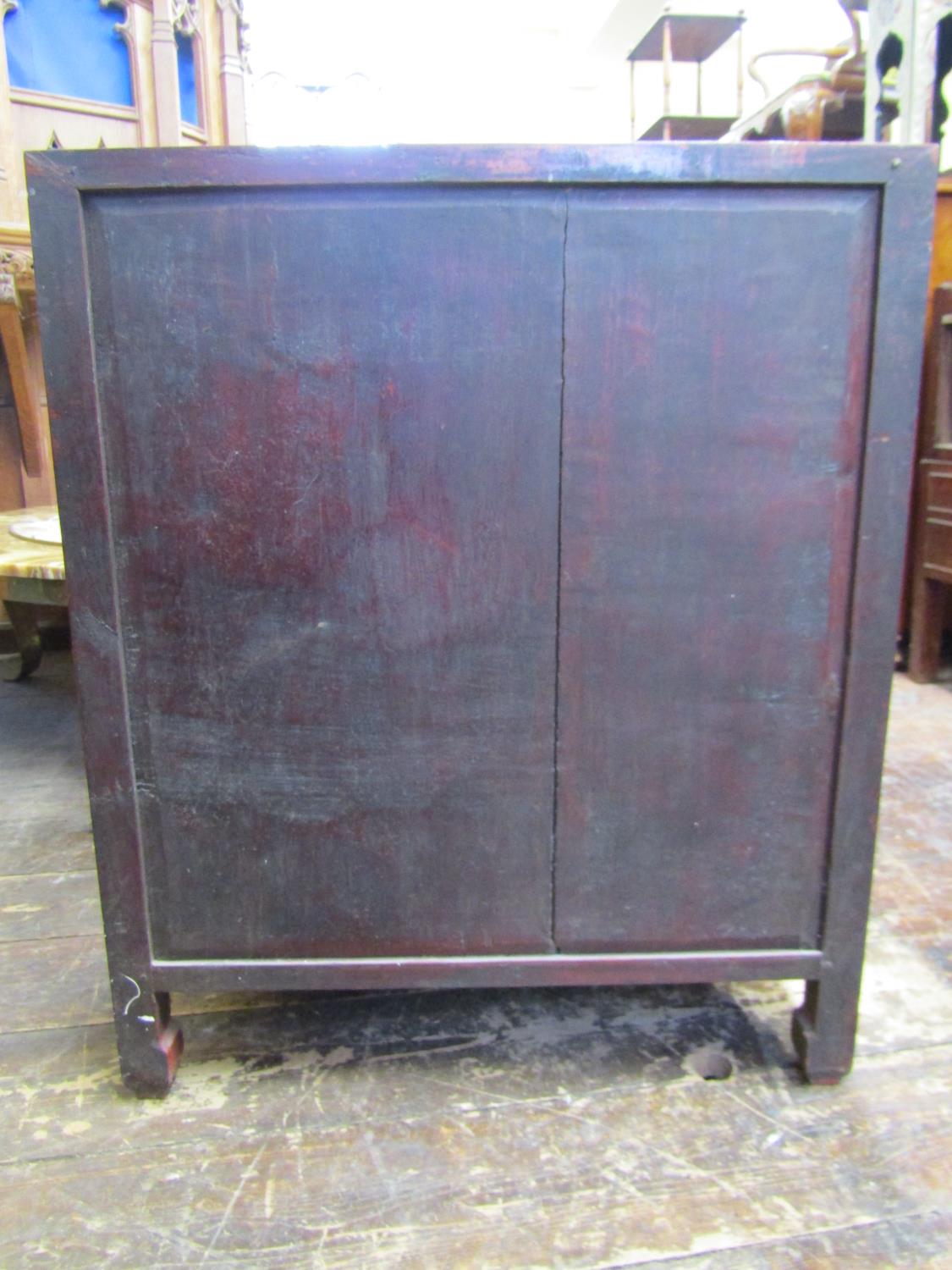 A 19th century Chinese side cupboard, enclosed by two glazed panelled doors over two frieze - Image 5 of 6