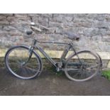 A vintage Raleigh bicycle with original all steel green painted frame, Sturmey Archer four speed,
