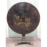 A Regency black lacquered and japanned snap top occasional table, the 92cm diameter top decorated