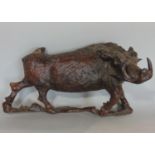 A carved hardwood figure of a wild boar, 40cm long