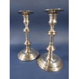Pair of 1950s Georgian style stepped circular silver candlesticks, maker Richard Comyns, London
