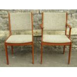 A set of 8 (6+2) mid-20th century dining chairs with dished upholstered pad seats and backs within