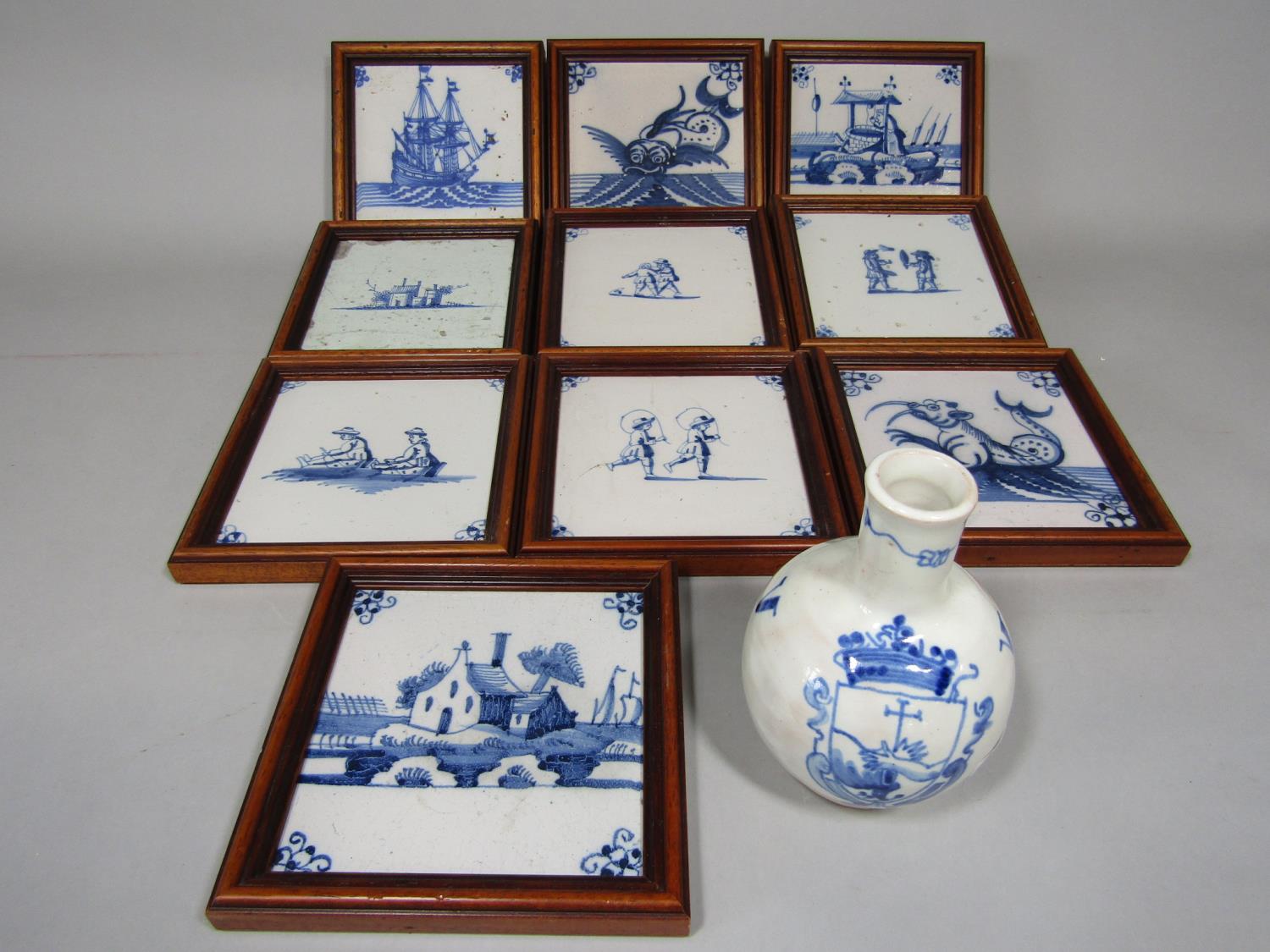 A collection of ten various 19th century delft blue and white tiles with painted decoration