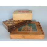 A Victorian travel chess set with folding timber frame containing a chess set in box wood and ebony,