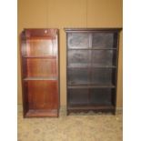 A small 1920's oak freestanding open bookcase with fixed shelves and applied split mouldings one