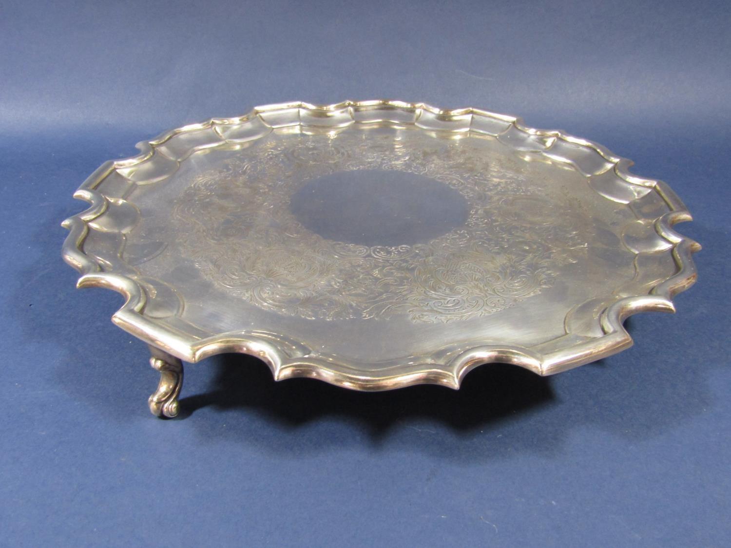 Georgian style early 20th century silver salver, with pie crust rim and engraved foliate decoration,