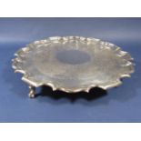 Georgian style early 20th century silver salver, with pie crust rim and engraved foliate decoration,