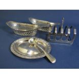A collection of silver comprising a pair of oval bonbon dishes with pierced diaper raised rims,