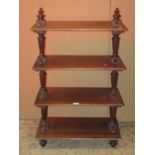 A 19th century walnut etagere on four rectangular tiers with fluted baluster supports and turned