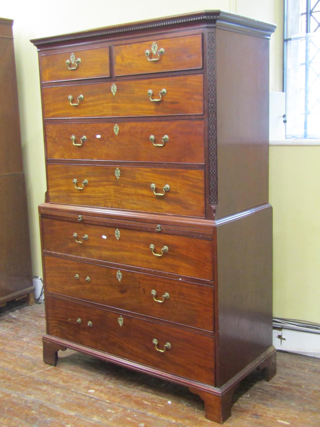 A Georgian mahogany chest on chest of six long and two short drawers with central brushing slide,