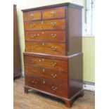 A Georgian mahogany chest on chest of six long and two short drawers with central brushing slide,
