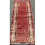 Persian Saruki Mia full pile runner, with geometric design upon a washed red ground, 285 x 110 cm